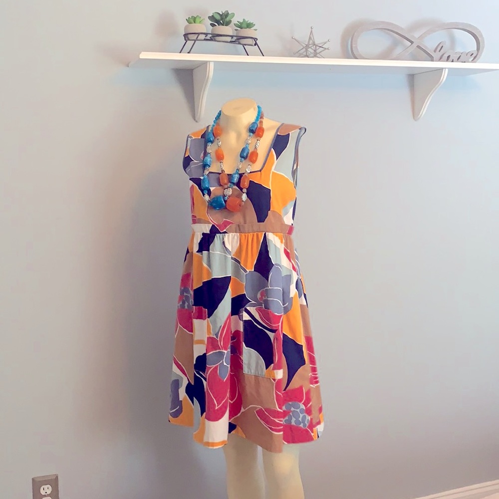 Cute summer dress. Floral design in muted colors.